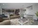 Open living space with a view of the kitchen and staircase at 19690 W Marshall Ave, Litchfield Park, AZ 85340