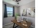Comfortable home office featuring a ceiling fan and a window with neighborhood views at 19690 W Marshall Ave, Litchfield Park, AZ 85340