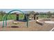Community playground with swings and a shaded picnic area for outdoor enjoyment at 19690 W Marshall Ave, Litchfield Park, AZ 85340