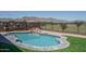 Refreshing pool with rock feature provides a serene and luxurious backyard experience at 19690 W Marshall Ave, Litchfield Park, AZ 85340