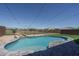 Backyard pool features patio, landscaping, and an iron fence at 19690 W Marshall Ave, Litchfield Park, AZ 85340