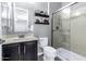 Bathroom featuring dark wood cabinets, floating shelves, neutral walls and a glass enclosed shower at 19943 E Strawberry Dr, Queen Creek, AZ 85142