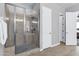 Beautiful bathroom with a stand-up shower with glass doors and a tiled floor at 19943 E Strawberry Dr, Queen Creek, AZ 85142