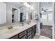 Dual-sink bathroom vanity, with modern fixtures and neutral tones, and a view into the bedroom at 19943 E Strawberry Dr, Queen Creek, AZ 85142