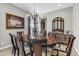 Elegant dining room with a decorative chandelier and classic wooden furniture at 19943 E Strawberry Dr, Queen Creek, AZ 85142