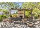 Inviting outdoor fireplace area with seating, perfect for gathering and enjoying the peaceful surroundings at 19943 E Strawberry Dr, Queen Creek, AZ 85142