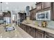 Modern kitchen featuring granite countertops, stainless steel appliances, and ample cabinet space at 19943 E Strawberry Dr, Queen Creek, AZ 85142