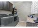 Well-equipped laundry room with updated washer and dryer and plenty of storage at 19943 E Strawberry Dr, Queen Creek, AZ 85142
