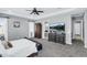 Spacious main bedroom with large dresser and mounted television at 19943 E Strawberry Dr, Queen Creek, AZ 85142