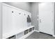 Organized mudroom features a built-in bench with storage and coat hooks near entry at 19943 E Strawberry Dr, Queen Creek, AZ 85142