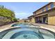 Stunning backyard with a private pool, spa, and brick patio, perfect for relaxing or entertaining at 19943 E Strawberry Dr, Queen Creek, AZ 85142