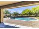 Relaxing backyard with a private pool, spa, mature trees, and well-manicured landscaping at 19943 E Strawberry Dr, Queen Creek, AZ 85142