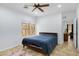Bright bedroom with a ceiling fan and neutral decor, providing a simple and relaxing retreat within the home at 204 S Valle Verde --, Mesa, AZ 85208