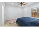 Cozy bedroom with a ceiling fan and neutral decor, providing a simple and relaxing retreat within the home at 204 S Valle Verde --, Mesa, AZ 85208