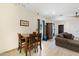 Cozy dining area adjacent to the living room with a small table and chairs at 204 S Valle Verde --, Mesa, AZ 85208