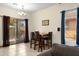 Cozy dining area with a chandelier and easy access to the backyard through sliding doors at 204 S Valle Verde --, Mesa, AZ 85208