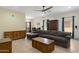 Open-concept living area with tile flooring, large windows, and a cozy sofa at 204 S Valle Verde --, Mesa, AZ 85208