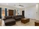 Spacious living room with tile floors, a comfortable sofa, and a ceiling fan at 204 S Valle Verde --, Mesa, AZ 85208