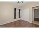 Bedroom with hardwood floors, closet, and window at 21532 N 65Th Ave, Glendale, AZ 85308
