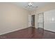 Bedroom featuring hardwood floors, ceiling fan, and closet at 21532 N 65Th Ave, Glendale, AZ 85308