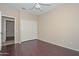 Bedroom showcasing spacious layout, hardwood floors, and an adjacent closet at 21532 N 65Th Ave, Glendale, AZ 85308