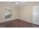 Bedroom with natural light, ceiling fan, and hardwood floors at 21532 N 65Th Ave, Glendale, AZ 85308