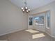 A dining area is brightened by natural light from the bay windows, complemented by tile flooring at 21532 N 65Th Ave, Glendale, AZ 85308