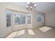 A dining area is brightened by natural light from the bay windows, complemented by tile flooring at 21532 N 65Th Ave, Glendale, AZ 85308