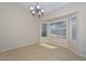 A dining area is brightened by natural light from the bay windows, complemented by tile flooring at 21532 N 65Th Ave, Glendale, AZ 85308