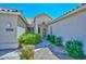 Front entrance with decorative door, well maintained landscaping, and clean walkway at 21532 N 65Th Ave, Glendale, AZ 85308