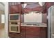 A kitchen with custom cabinets, stainless steel appliances, and granite countertops provides ample space at 21532 N 65Th Ave, Glendale, AZ 85308