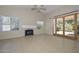 Inviting living room with a fireplace, tile flooring, and sliding glass doors that open to the outdoor patio at 21532 N 65Th Ave, Glendale, AZ 85308