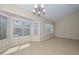 Bright living room featuring ample natural light, tile floors, and a cozy ambiance, creating a welcoming space at 21532 N 65Th Ave, Glendale, AZ 85308