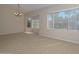 A living area is brightened by natural light from the bay windows, complemented by tile flooring at 21532 N 65Th Ave, Glendale, AZ 85308