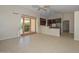 Open floor plan with seamless flow from the living area to the modern kitchen, perfect for entertaining at 21532 N 65Th Ave, Glendale, AZ 85308