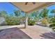An outdoor patio with decorative concrete, ceiling fan, and lush landscaping at 21532 N 65Th Ave, Glendale, AZ 85308