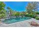 Beautiful backyard pool with rock waterfall feature and lush landscaping at 21532 N 65Th Ave, Glendale, AZ 85308