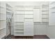 Spacious walk-in closet with custom shelving and drawers for optimal organization at 21532 N 65Th Ave, Glendale, AZ 85308
