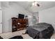 Well-lit bedroom with wood shelving and a covered bed at 220 N 22Nd Pl # 2029, Mesa, AZ 85213