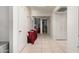 Bright hallway with neutral tile flooring leads to other rooms in the home at 220 N 22Nd Pl # 2029, Mesa, AZ 85213
