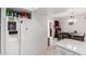Bright kitchen with white appliances and a view to the dining area, refrigerator and ample storage at 220 N 22Nd Pl # 2029, Mesa, AZ 85213