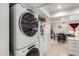 Kitchen featuring stackable washer and dryer, fridge and dining table at 220 N 22Nd Pl # 2029, Mesa, AZ 85213