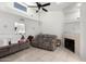 Inviting living room with a fireplace, comfortable seating, and a view to other rooms at 220 N 22Nd Pl # 2029, Mesa, AZ 85213