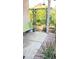 Backyard patio featuring a green bench, an arched metal trellis, and lush landscaping creates a tranquil outdoor space at 2221 E Union Hills Dr # 157, Phoenix, AZ 85024