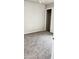 Bedroom with neutral carpet and paint, featuring a closet with sliding doors, providing a calm and inviting atmosphere at 2221 E Union Hills Dr # 157, Phoenix, AZ 85024