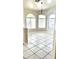 Bright dining room features a chandelier, tiled floor, and arched windows overlooking the front yard at 2221 E Union Hills Dr # 157, Phoenix, AZ 85024