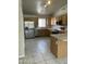 Spacious kitchen with light wood cabinets, stainless steel appliances, and tiled floors at 2221 E Union Hills Dr # 157, Phoenix, AZ 85024