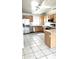 Well-lit kitchen featuring stainless steel appliances, wooden cabinets, and a spacious layout for cooking and entertaining at 2221 E Union Hills Dr # 157, Phoenix, AZ 85024