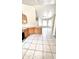 Open-concept living room showcasing tile flooring, abundant natural light, and an airy, welcoming atmosphere at 2221 E Union Hills Dr # 157, Phoenix, AZ 85024