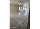 Bright living room featuring tile flooring, large windows, and a neutral color palette at 2221 E Union Hills Dr # 157, Phoenix, AZ 85024